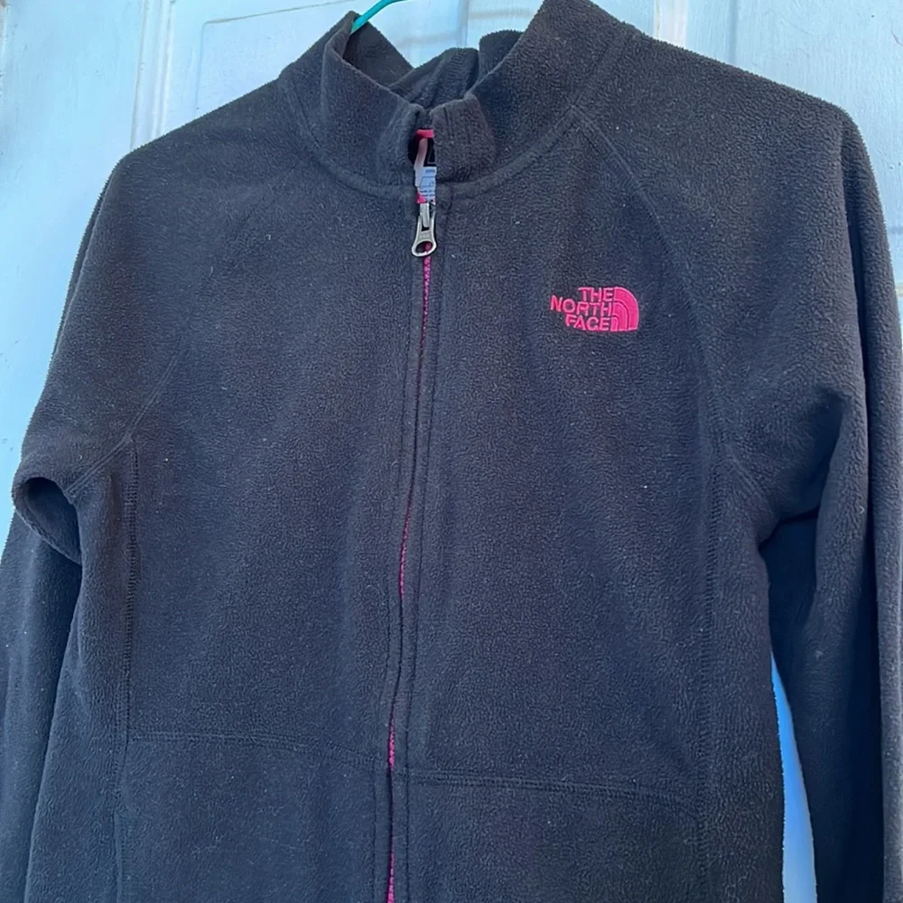 The North Face girls black fleece jacket in size medium 10-12
